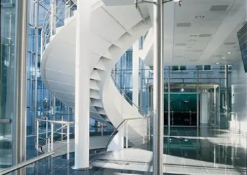 Glass atrium and spiral staircase at UBS Grünenhof